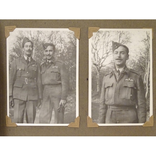 1041 - Militaria: a WWII / Second World War / World War 2 photograph album, containing 61 monochrome photog... 