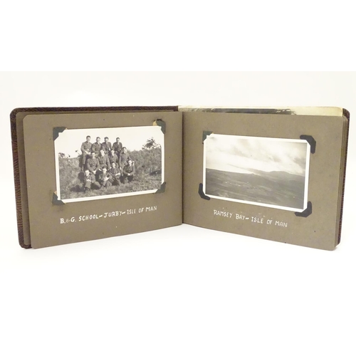 1041 - Militaria: a WWII / Second World War / World War 2 photograph album, containing 61 monochrome photog... 