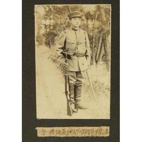 1042 - Militaria: an early 20thC photograph album of a Cavalry soldier of the Imperial Japanese Army, conta... 