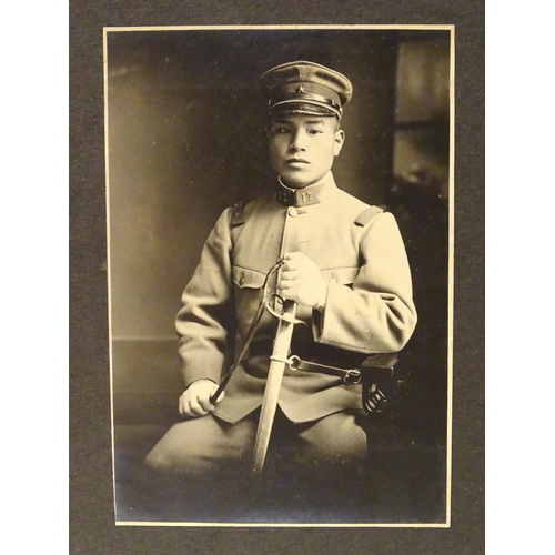 1042 - Militaria: an early 20thC photograph album of a Cavalry soldier of the Imperial Japanese Army, conta... 