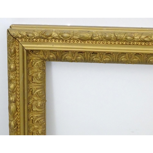 2518 - A 20thC gilt and gesso moulded frame with foliate detail. Approx. 25