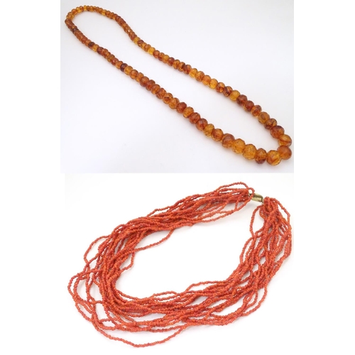 945 - A graduated bead necklace of facet cut amber coloured beads Approx 32