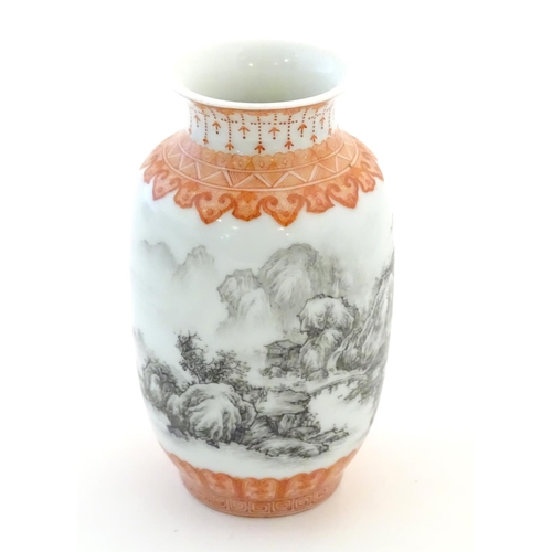 40 - A Chinese small vase with monochrome mountainous landscape detail and orange banded borders. Approx.... 