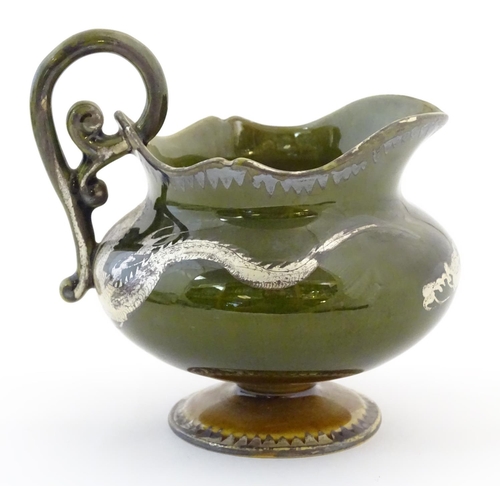 49 - An Oriental pedestal cream jug with gilt dragon detail. Impressed marks under. Approx. 4