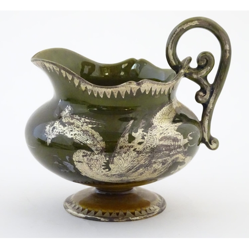 49 - An Oriental pedestal cream jug with gilt dragon detail. Impressed marks under. Approx. 4