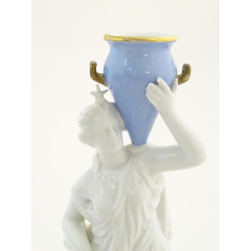 104 - A Continental model of a classical / mythological figure with a star crown, holding a blue twin hand... 