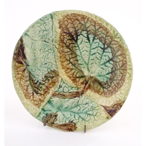 114 - Two majolica Begonia leaf plates of circular form. Approx. 8 1/4