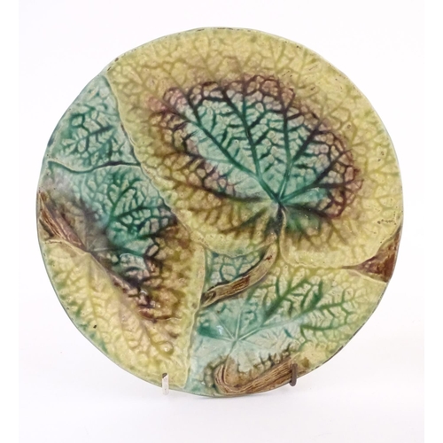 114 - Two majolica Begonia leaf plates of circular form. Approx. 8 1/4