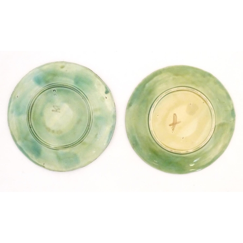 114 - Two majolica Begonia leaf plates of circular form. Approx. 8 1/4