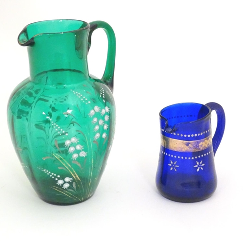 282 - A 19thC green glass jug with overpainted gypsophila flower decoration, together with an early 19thC ... 