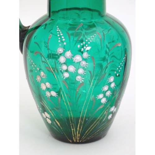 282 - A 19thC green glass jug with overpainted gypsophila flower decoration, together with an early 19thC ... 