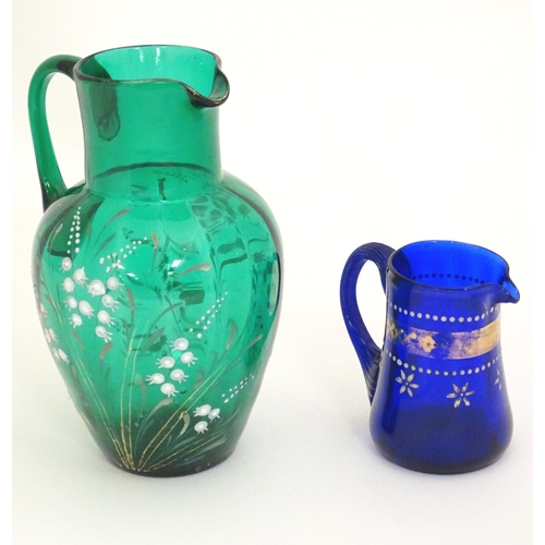 282 - A 19thC green glass jug with overpainted gypsophila flower decoration, together with an early 19thC ... 