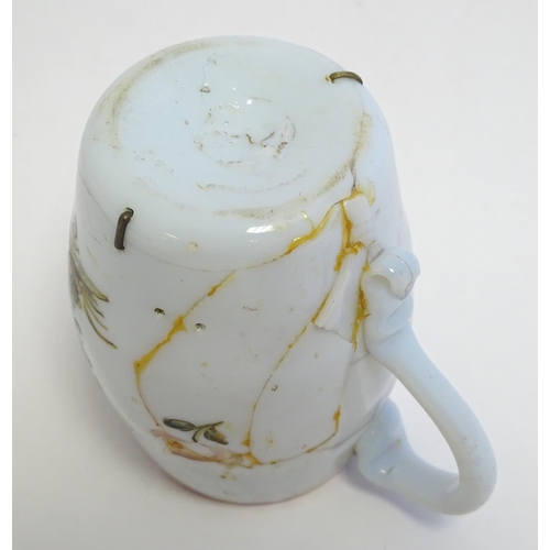 286 - An 18thC milk glass mug with hand painted decoration. 4