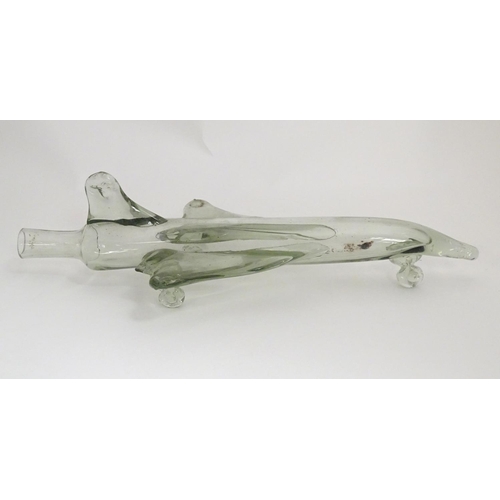 303 - A novelty glass decanter / bottle in the form of Concorde / delta wing jet / aeroplane, 16