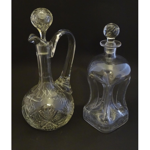 307 - A 19thC pinched crystal decanter, the stopper with swirl decoration, together with a 19thC claret ju... 