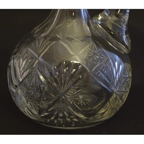 307 - A 19thC pinched crystal decanter, the stopper with swirl decoration, together with a 19thC claret ju... 