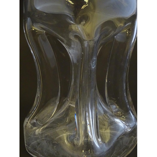 307 - A 19thC pinched crystal decanter, the stopper with swirl decoration, together with a 19thC claret ju... 