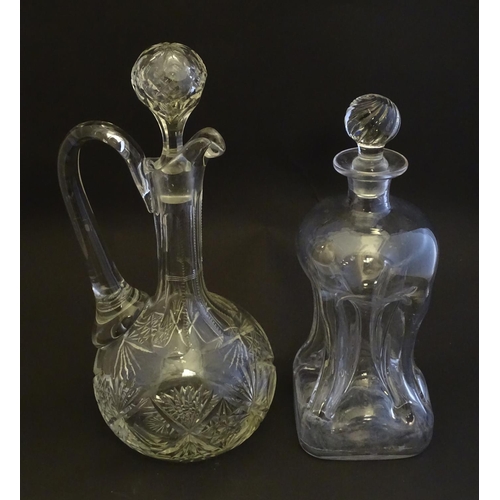 307 - A 19thC pinched crystal decanter, the stopper with swirl decoration, together with a 19thC claret ju... 