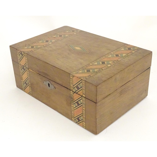 1174 - An early 20thC walnut work box with inlaid stained geometric detail. Approx. 4 1/4