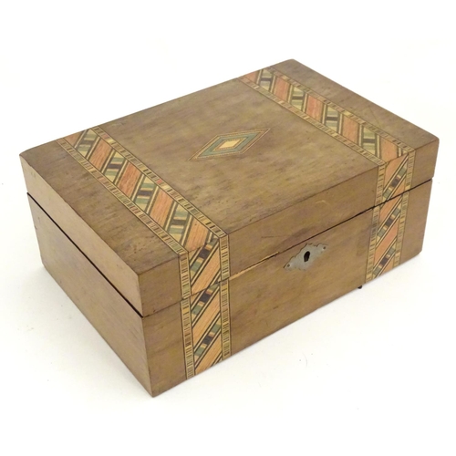 1174 - An early 20thC walnut work box with inlaid stained geometric detail. Approx. 4 1/4