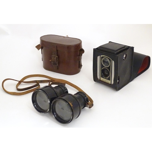 1191 - An early 20thC pair of field binoculars with sun shades, the barrels stamped Iris - Paris , Bull Dog... 