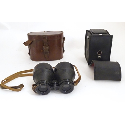 1191 - An early 20thC pair of field binoculars with sun shades, the barrels stamped Iris - Paris , Bull Dog... 