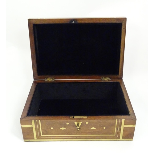 1192 - A Victorian mahogany box with brass banding and scrolling brass inlay. Approx. 4 1/2