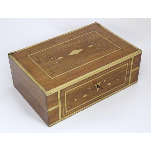 1192 - A Victorian mahogany box with brass banding and scrolling brass inlay. Approx. 4 1/2