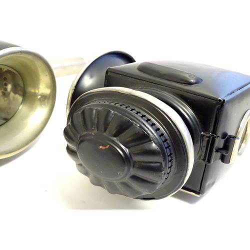 1198 - A pair of 20thC coaching style lamps / wall lights, with tin frames, glass panels and steel brackets... 