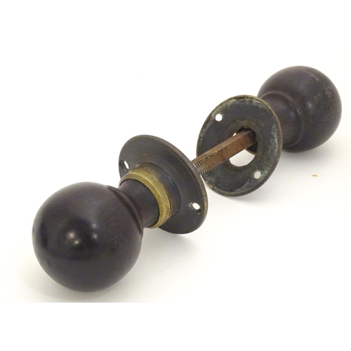 1212 - Four pairs of Victorian ebonised door knobs / handles / door furniture with brass mounts. Largest ap... 