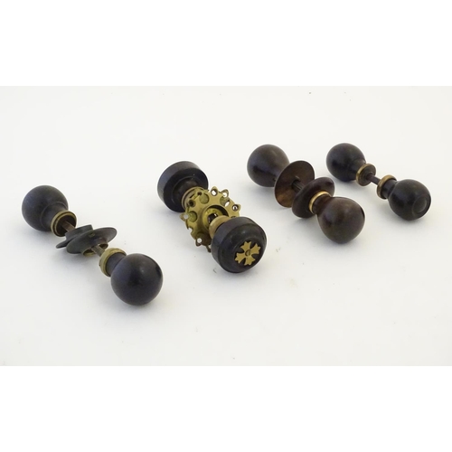 1212 - Four pairs of Victorian ebonised door knobs / handles / door furniture with brass mounts. Largest ap... 