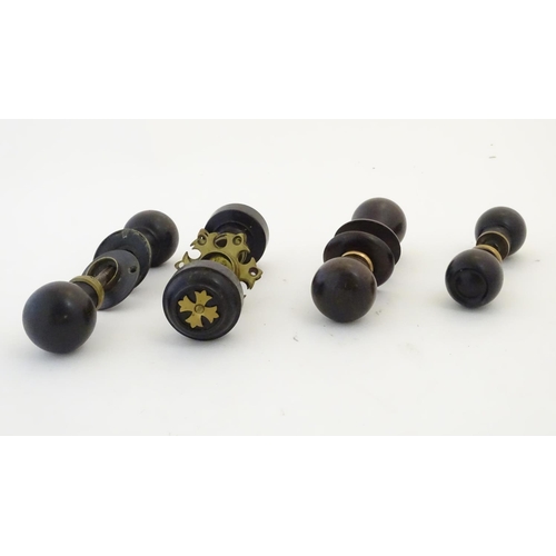 1212 - Four pairs of Victorian ebonised door knobs / handles / door furniture with brass mounts. Largest ap... 