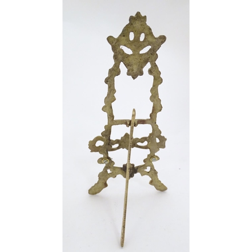 1226 - Two 19thC cast brass table top easels, one with floral and foliate detail, the other surmounted by r... 