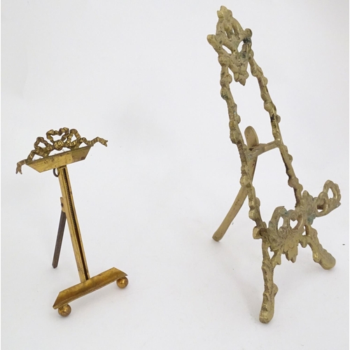 1226 - Two 19thC cast brass table top easels, one with floral and foliate detail, the other surmounted by r... 