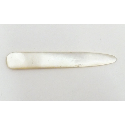 1229 - An early 20thC mother of pearl letter opener with shell detail. Approx. 4 1/4