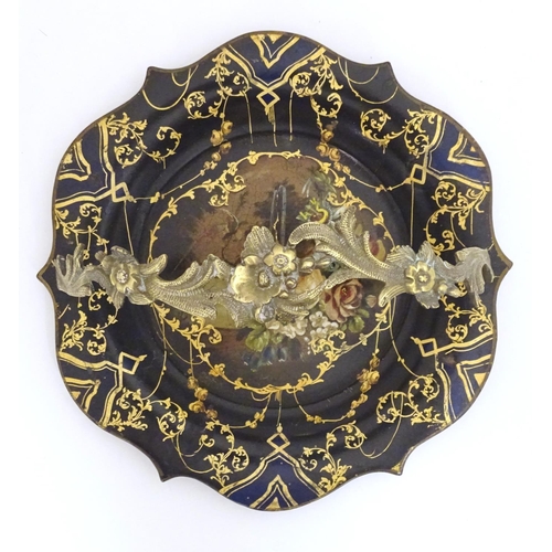 1233 - A Victorian papier mache dish with swing handle with lacquered and painted decoration depicting flow... 