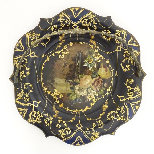 1233 - A Victorian papier mache dish with swing handle with lacquered and painted decoration depicting flow... 