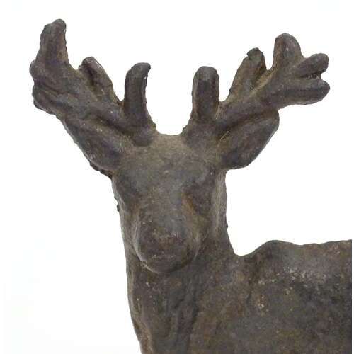 1253 - A 20thC cast doorstop / door porter modelled as a stag. Approx. 8 1/4