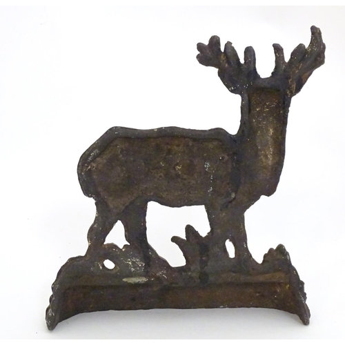 1253 - A 20thC cast doorstop / door porter modelled as a stag. Approx. 8 1/4