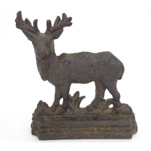 1253 - A 20thC cast doorstop / door porter modelled as a stag. Approx. 8 1/4