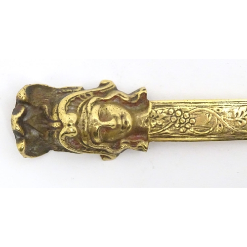 1278 - An early 20thC brass letter opener with classical head finial and grape and vine detail to blade. Ap... 