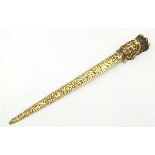 1278 - An early 20thC brass letter opener with classical head finial and grape and vine detail to blade. Ap... 