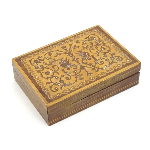 1331 - A 20thC parquetry box with scrolling foliate and stylised bird detail. Approx. 1 1/2