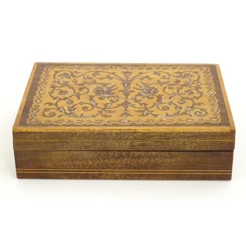 1331 - A 20thC parquetry box with scrolling foliate and stylised bird detail. Approx. 1 1/2