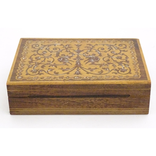 1331 - A 20thC parquetry box with scrolling foliate and stylised bird detail. Approx. 1 1/2