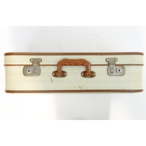 1341 - A mid 20thC set of three travelling suitcases by Cheney, London, in white with tan trim, each with d... 