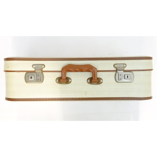 1341 - A mid 20thC set of three travelling suitcases by Cheney, London, in white with tan trim, each with d... 