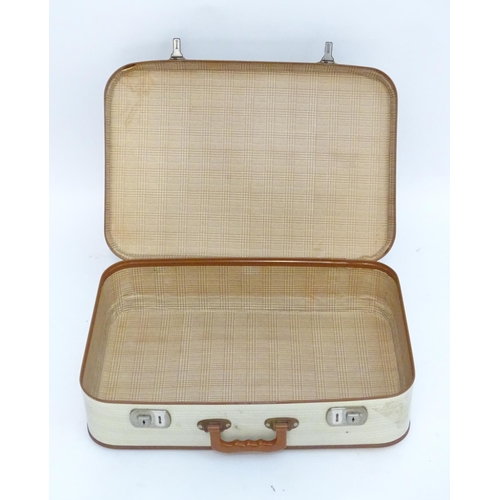 1341 - A mid 20thC set of three travelling suitcases by Cheney, London, in white with tan trim, each with d... 