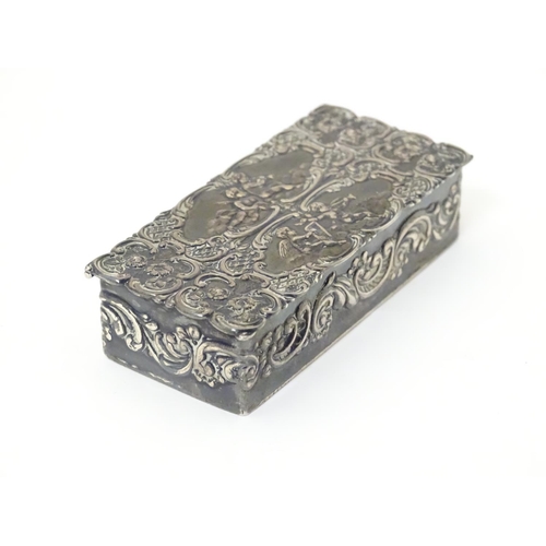 334 - A embossed silver box with a hinged lid opening to reveal a gilded interior, hallmarked London 1974,... 