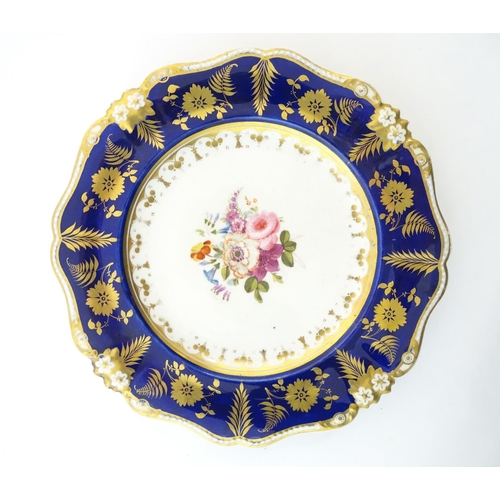 96 - A Bloor Derby plate with floral motif to centre and floral and foliate gilt border. Marked under. Ap... 